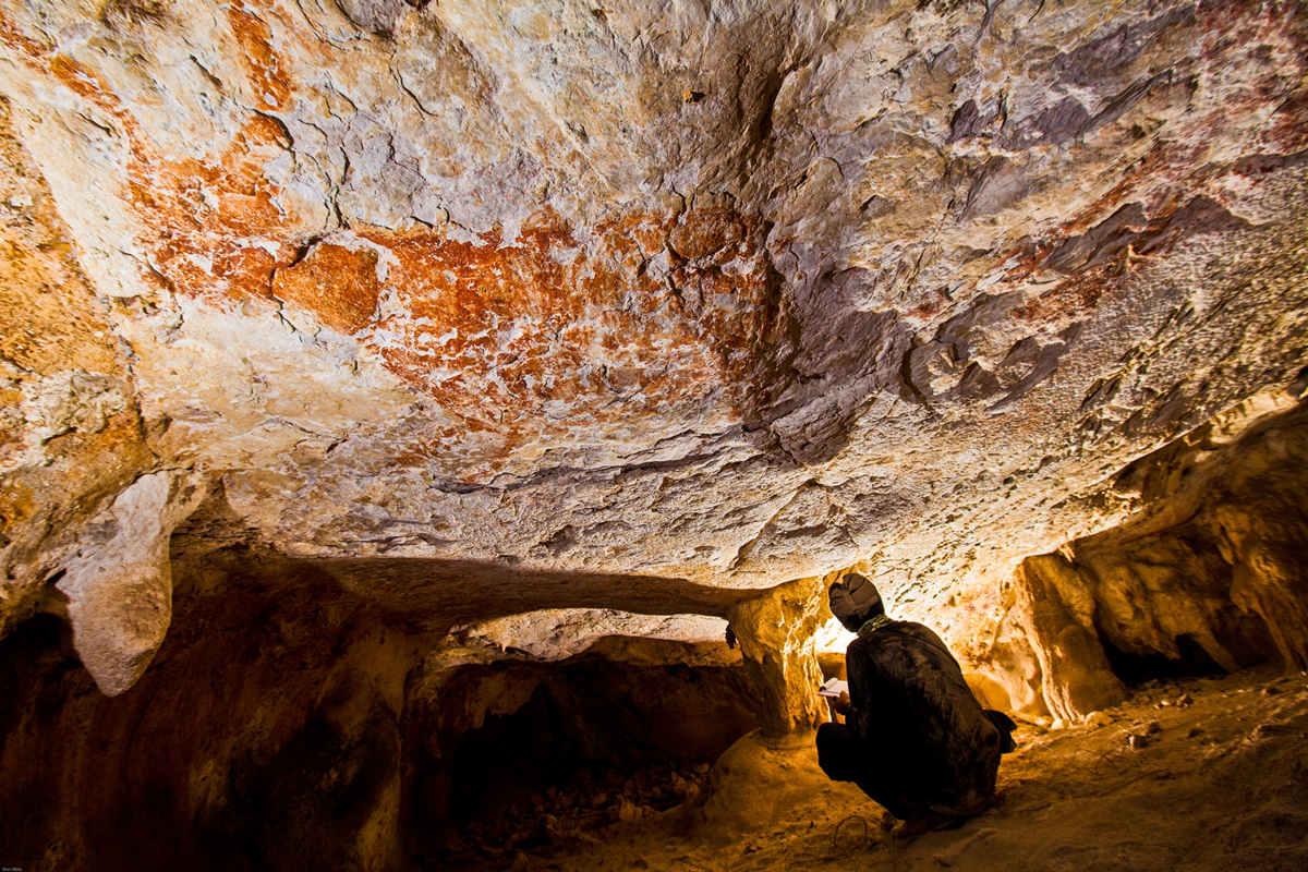 Researching the cave art paintings in Borneo