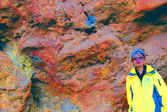 A bull from the Xianrendong rock art site (Yunnan, China) is a natural projection of stone that resembles a profile animal. It was painted with red ochre to highlight the head, front legs and side of the body. The head has a natural hole for an eye. The image was enhanced with DStretch. 