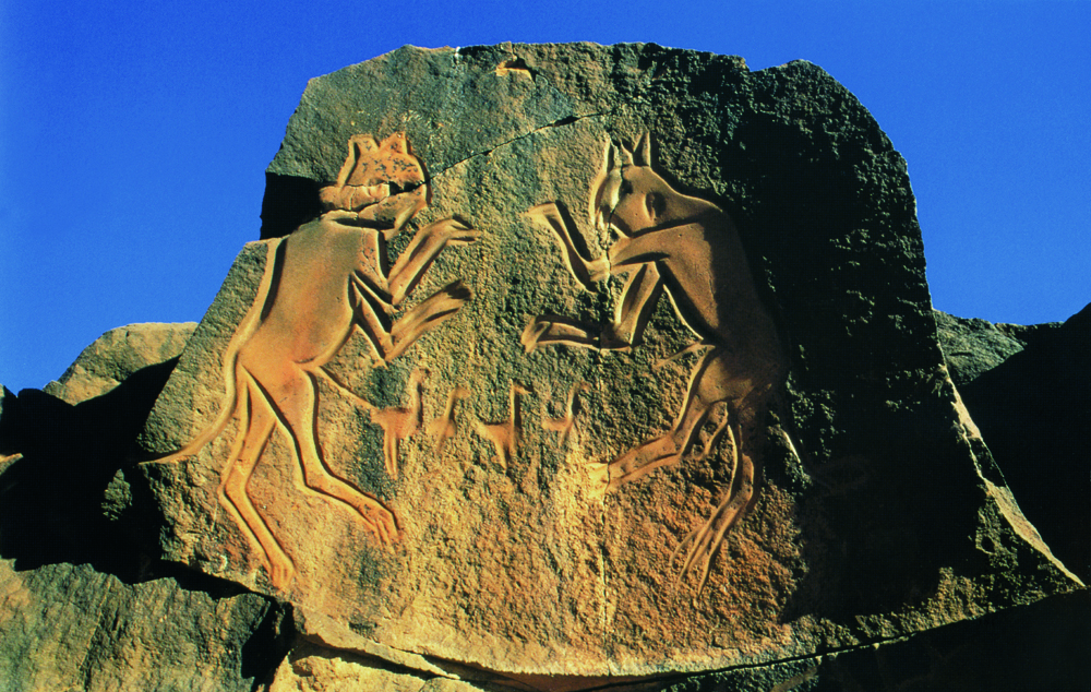fighting cats petroglyph in Libya