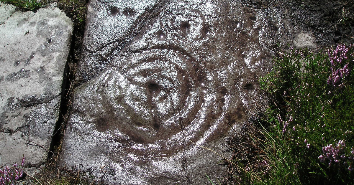 prehistoric rock art engravings Scotland archaeology