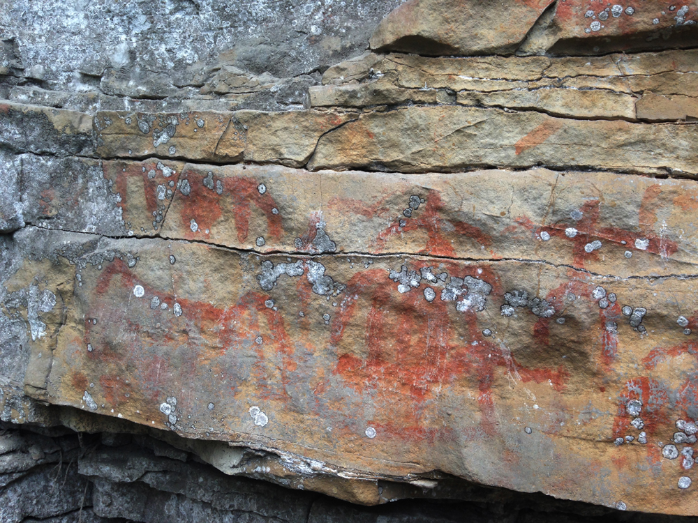 Wushan rock art with iron oxide