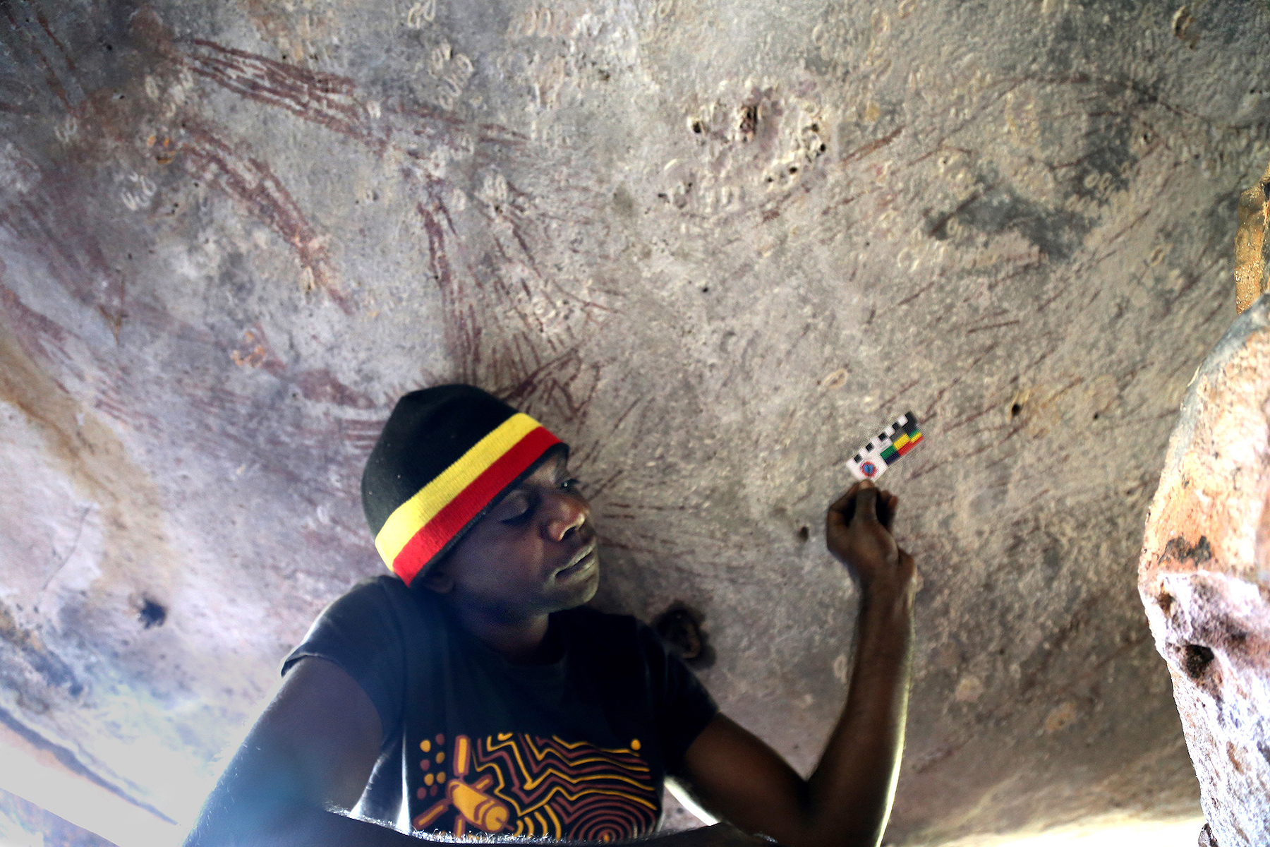 Traditional Owner Ian Waina with the kangaroo painting that was dated between 17,500 and 17,100 years old
