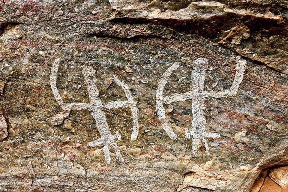 Rock art depicting two hunters Mel Saamy Kugai Coimbatore India