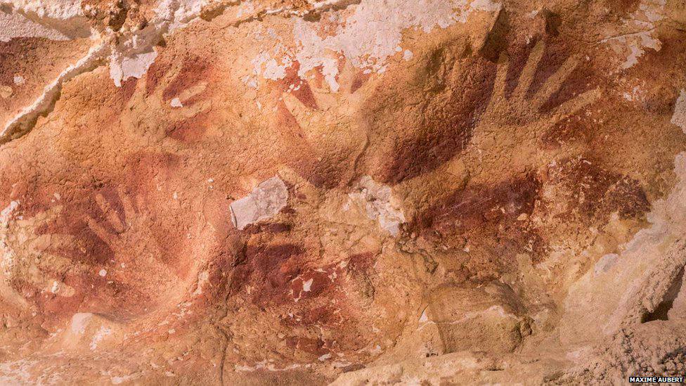 hand stencils dated in caves in indonesia
