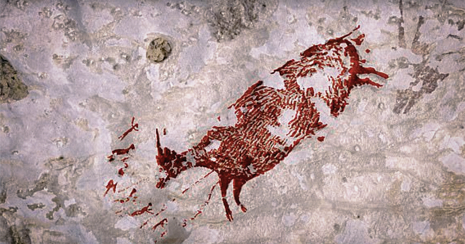 Indonesia sulawesi rock art human-like hunters fleeing mammals dated 44,000 years old cave art species