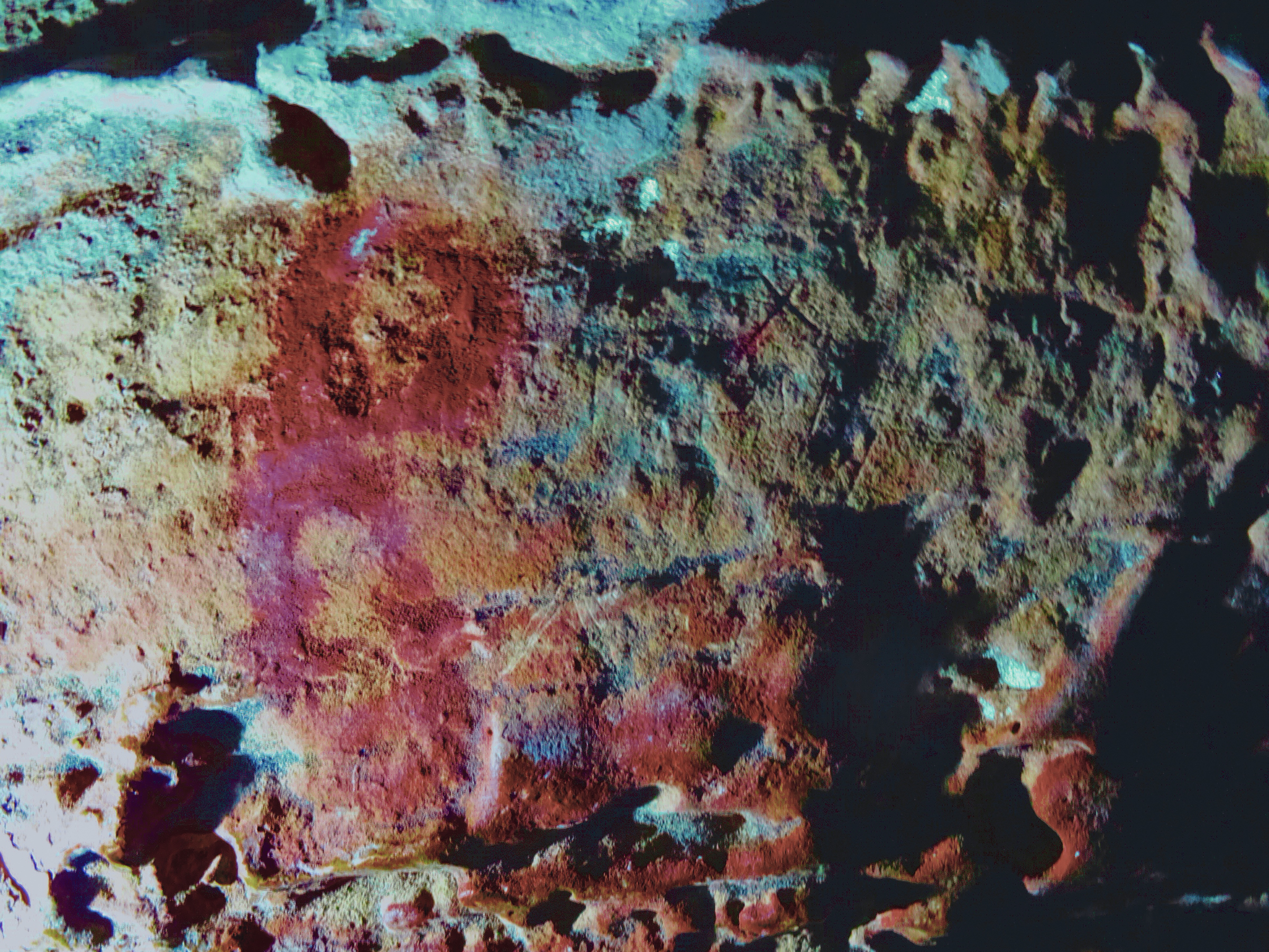 Panel E. D-Stretch image showing two complete circular motifs and the absorption stains around the applied painting