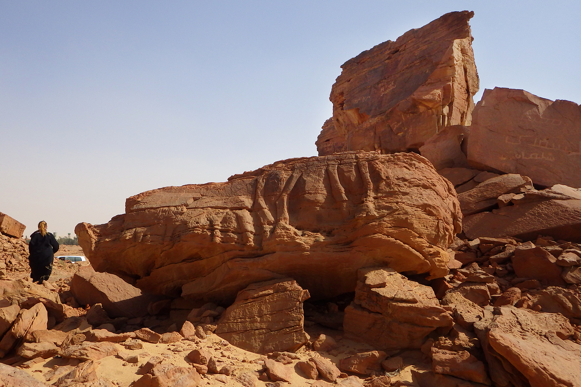 Legs of 2 large camels and low relief carvings of 2 small camels