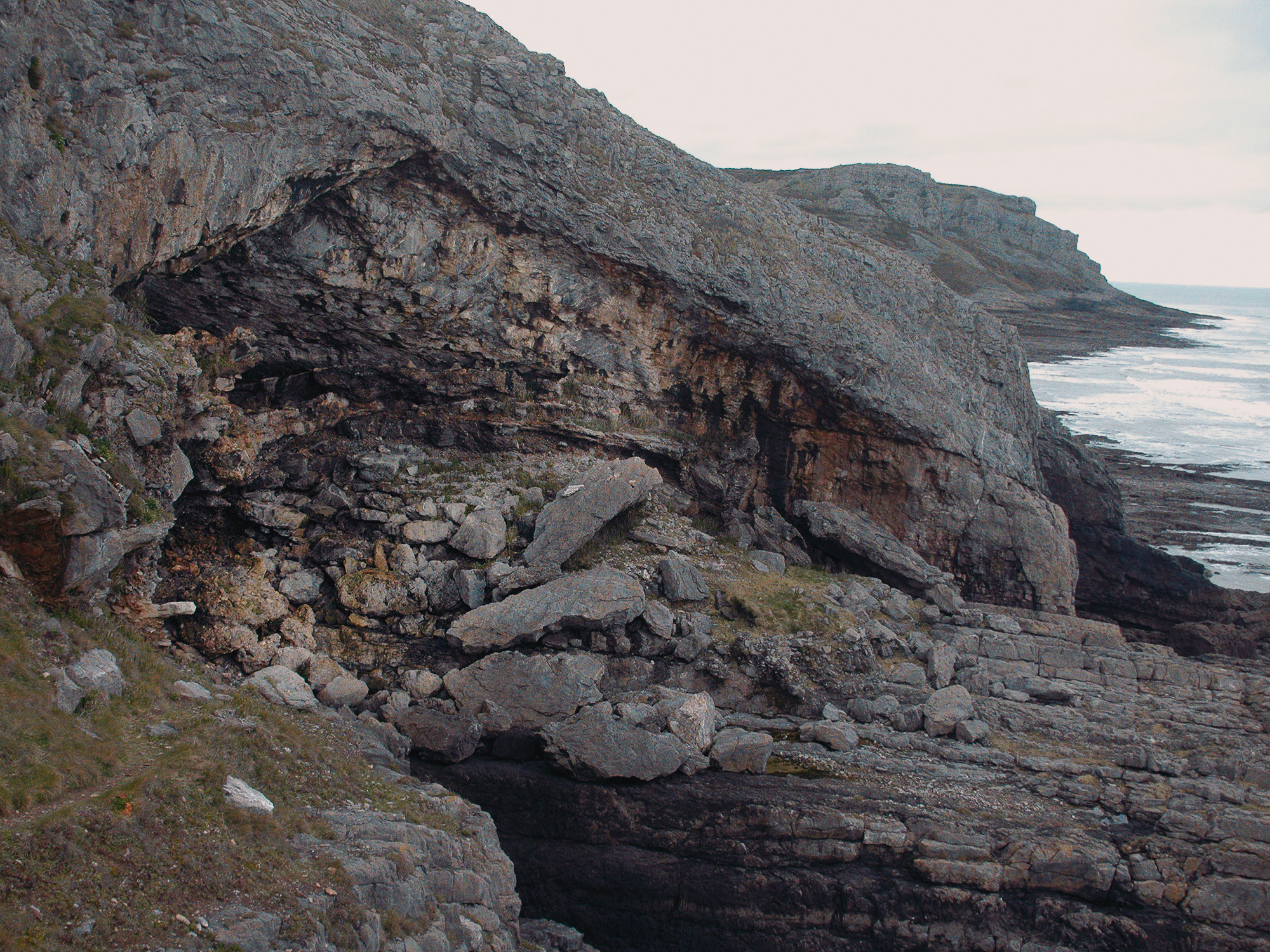 Bacon Hole within the limestone cliffs of south Gower