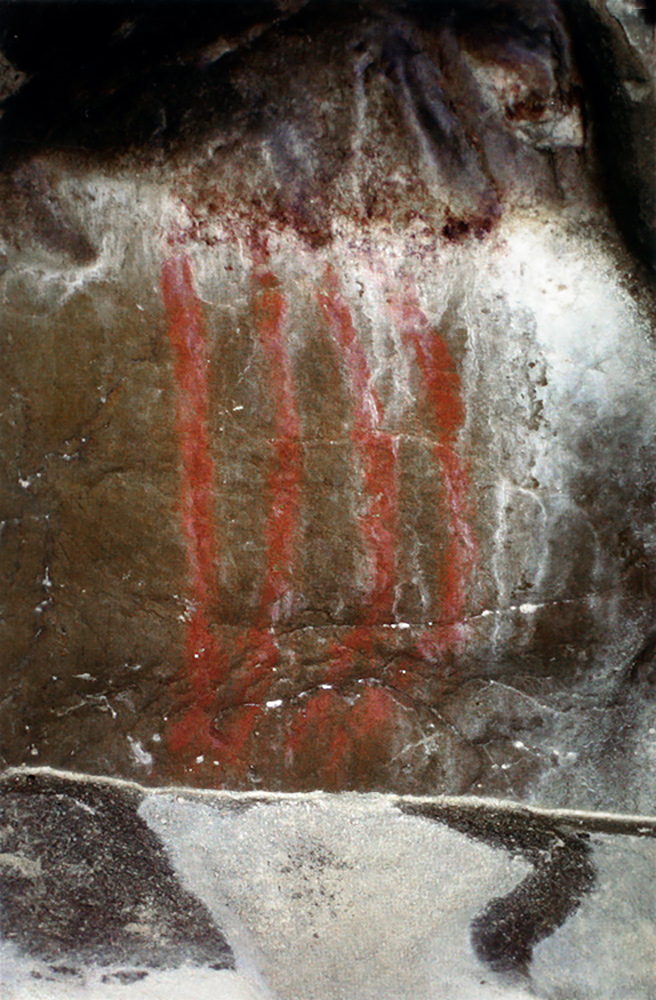 Red bars painted 400 metres from the Niaux cave entrance