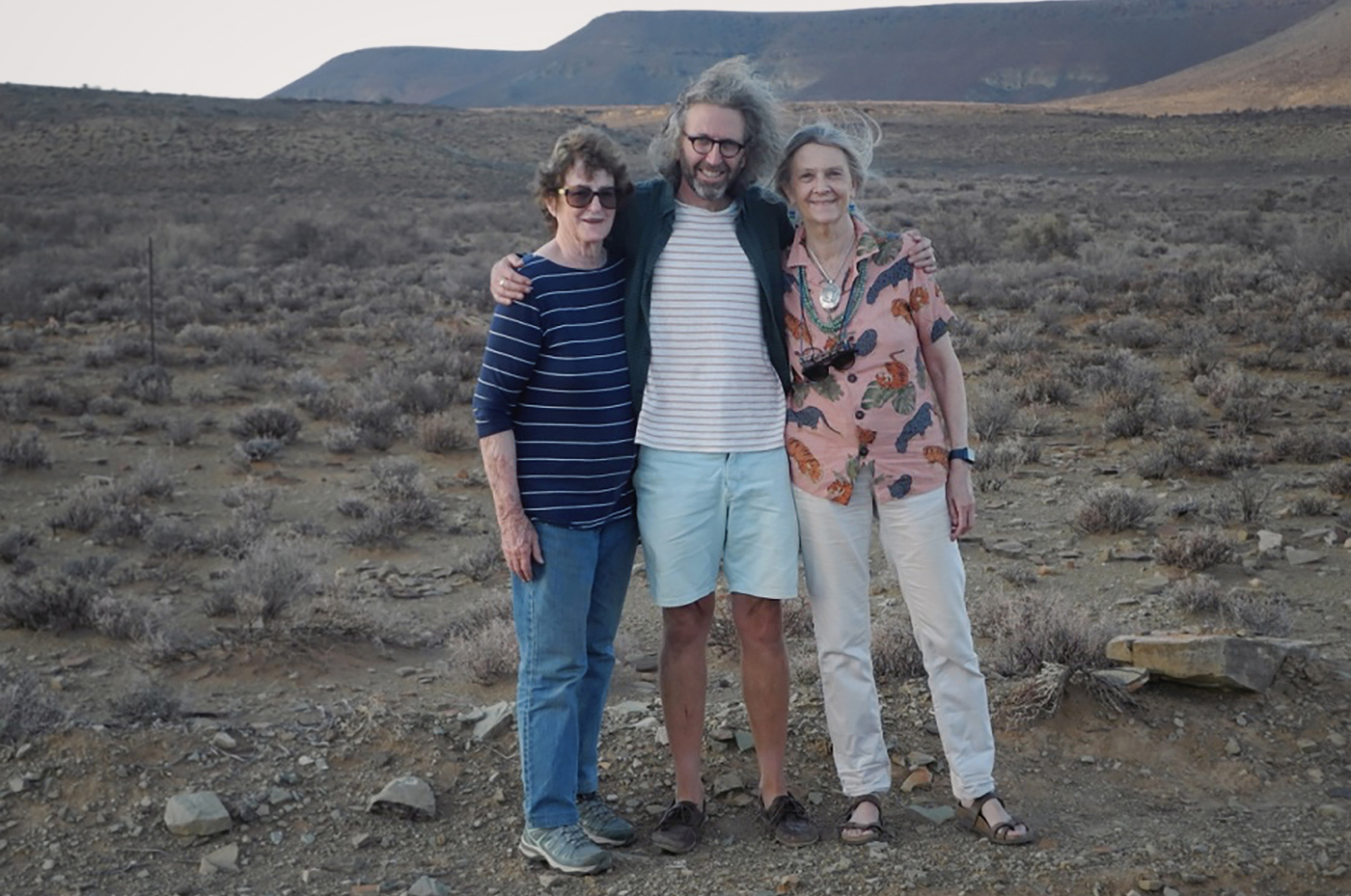 Janette Deacon, Bernhard Weiss and Pippa Skotnes in April 2021 below the hill with the young man turned to stone