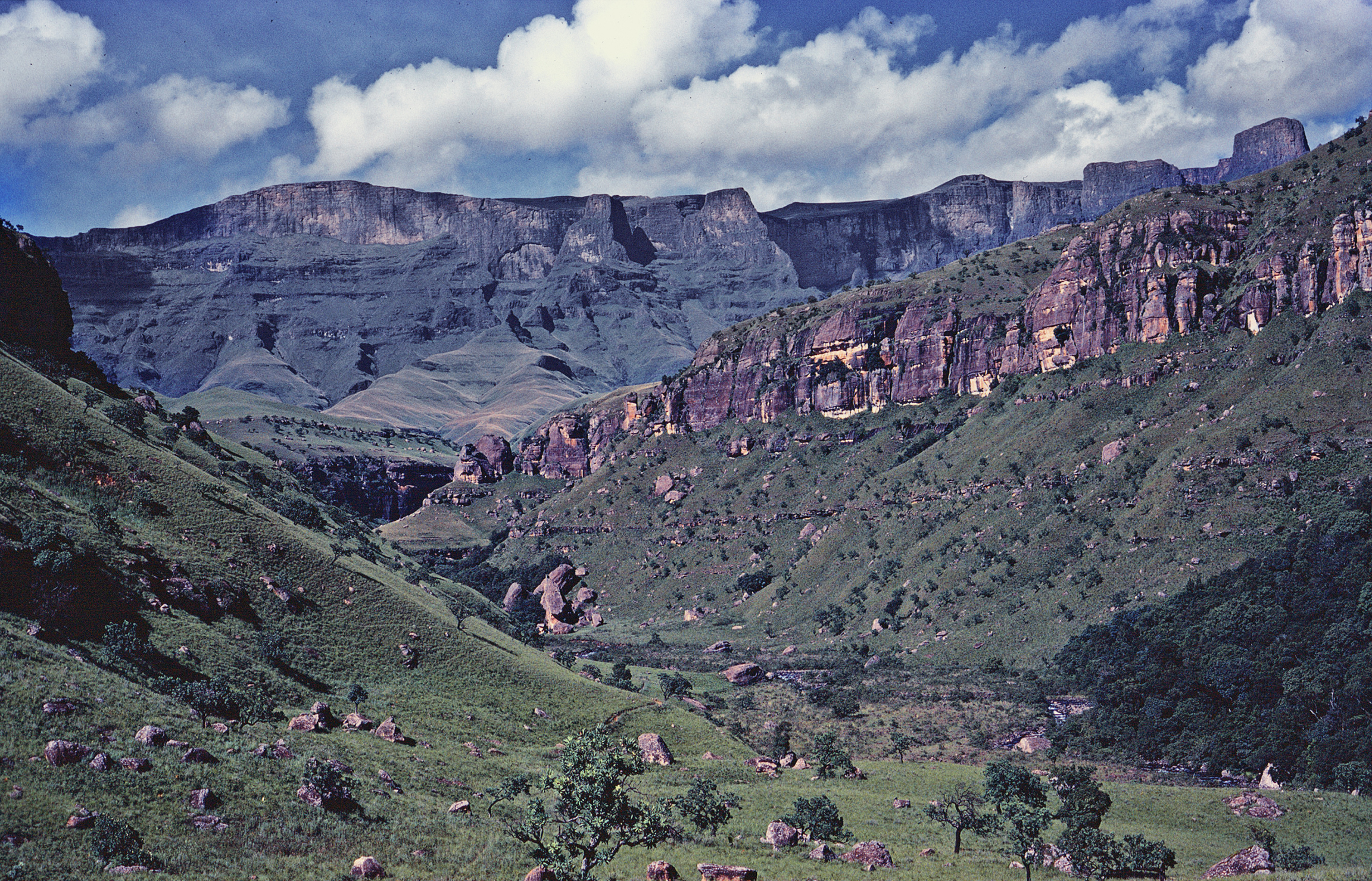 View up the Injasuthi River and the high uKhahlamba-Drakensberg Mountains from Copulation Rock, February 1980