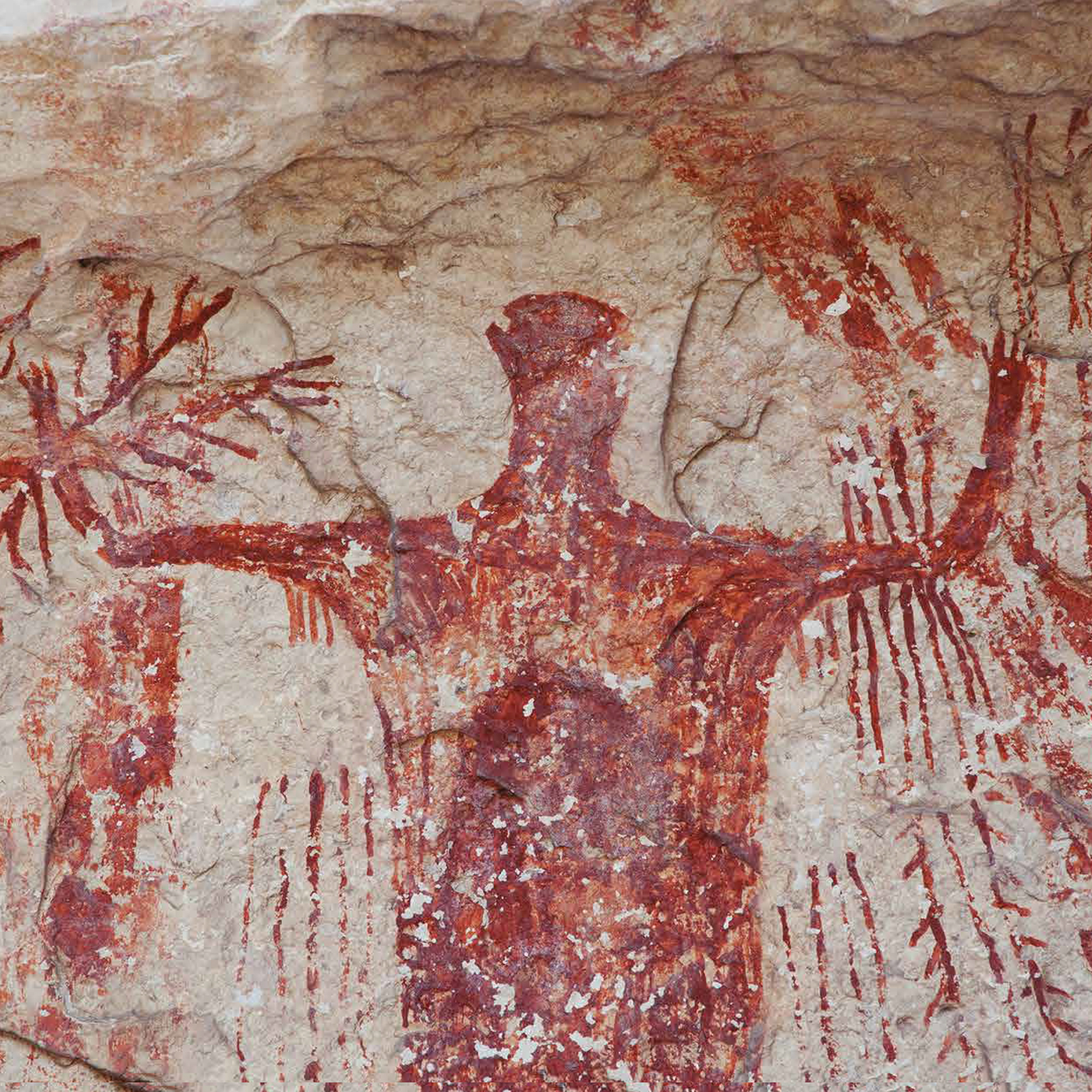 This powerful, red anthropomorph from Panther Cave displays a wide range of body adornments, paraphernalia, and weaponry