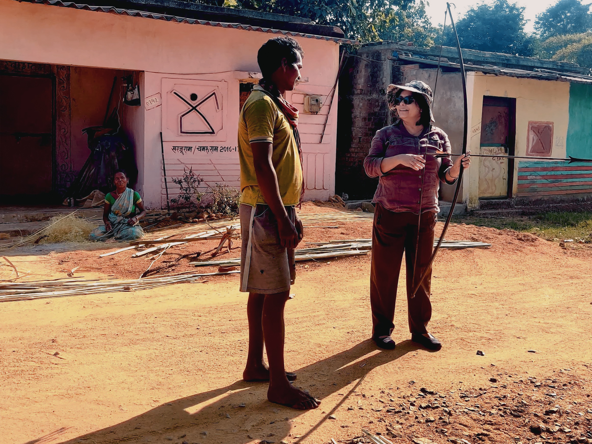 Women Hunters in Indian Rock Art An author is trying to bow and arrow in the Kamar tribe’s village.