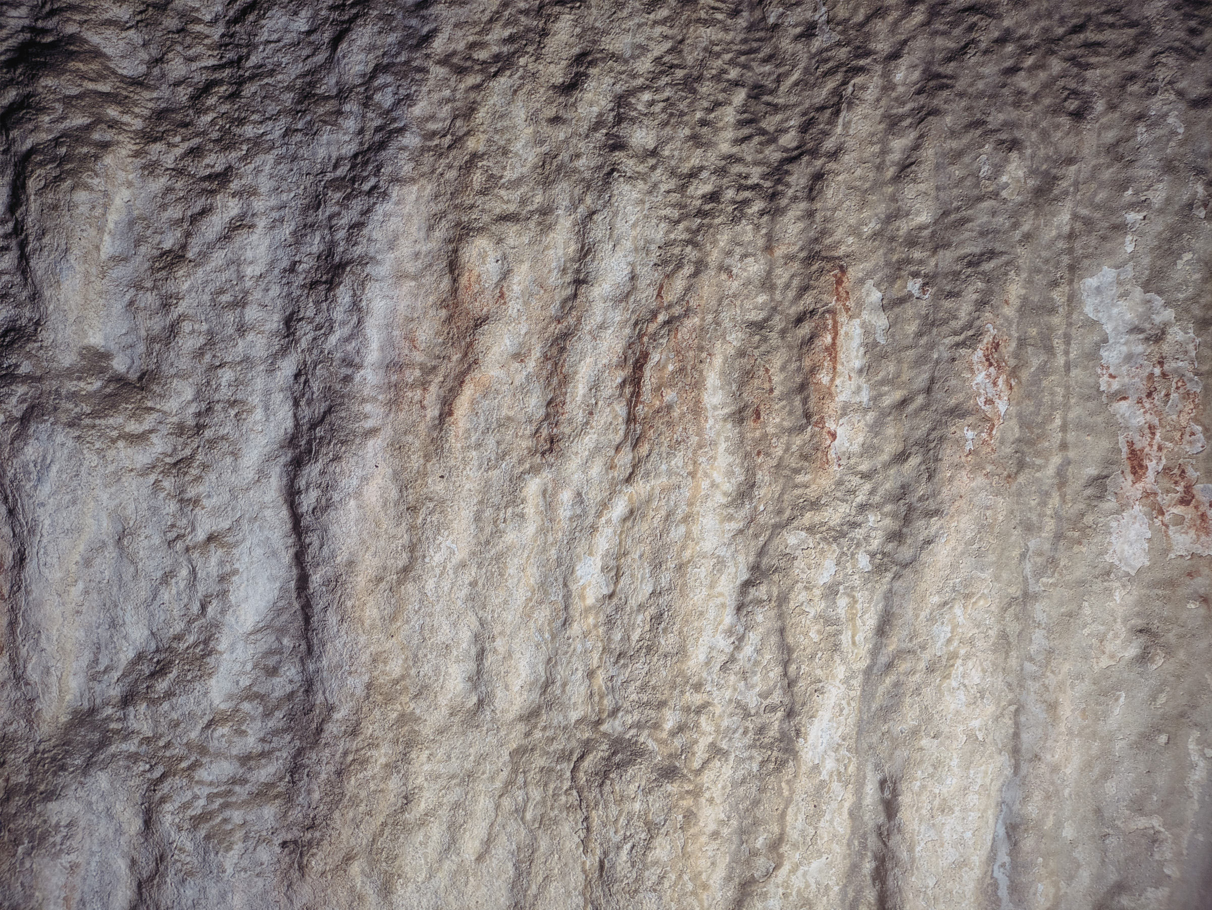 Ancient Rock Art Exploring Andalucia Painted Caves Spain Spite spreads projected marks on the calcite curtains at Nerja