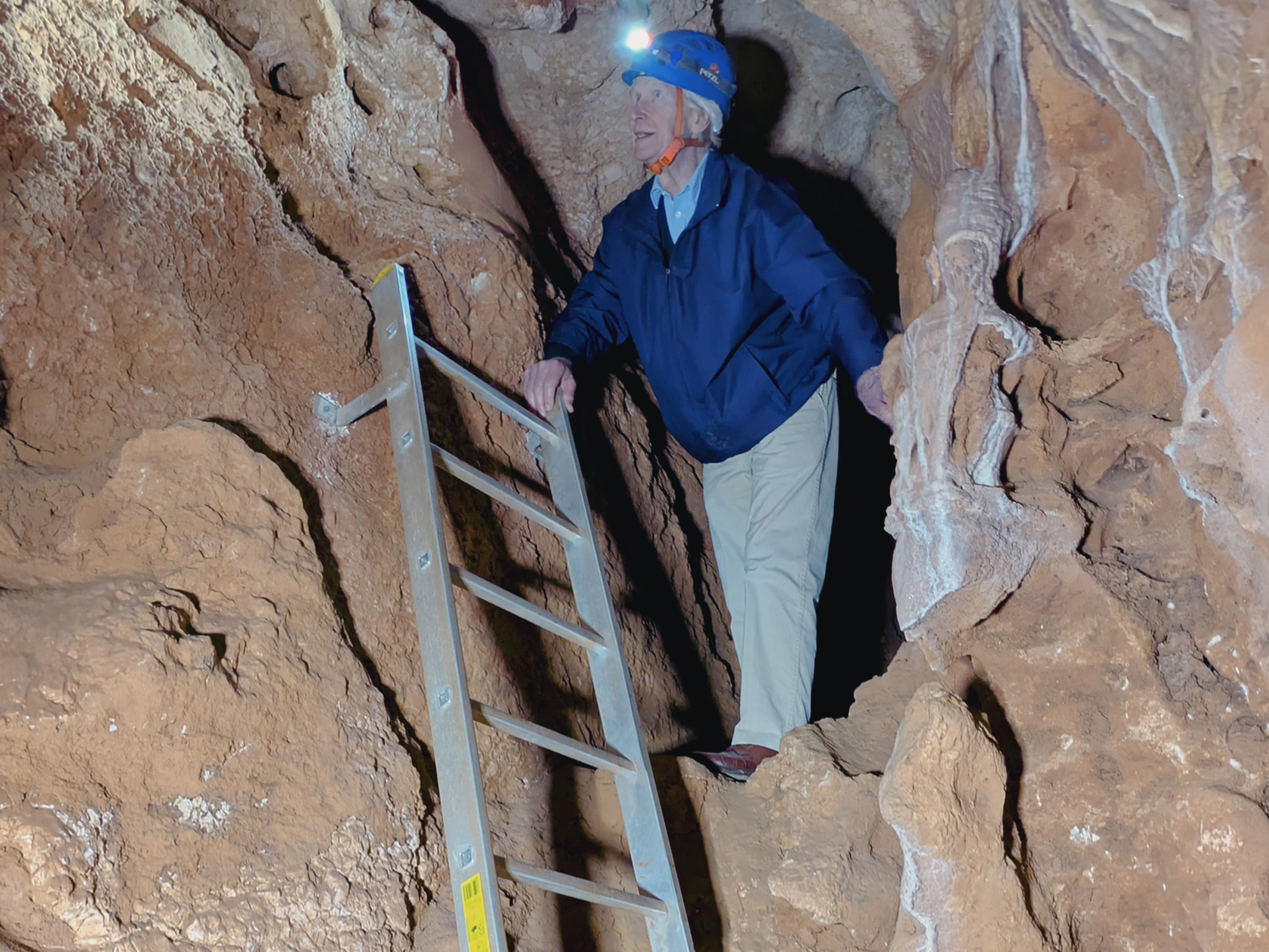 Ancient Rock Art Exploring Andalucia Painted Caves Spain Damon de Laszlo inspecting the walls of the second chamber of Cueva de la Victoria